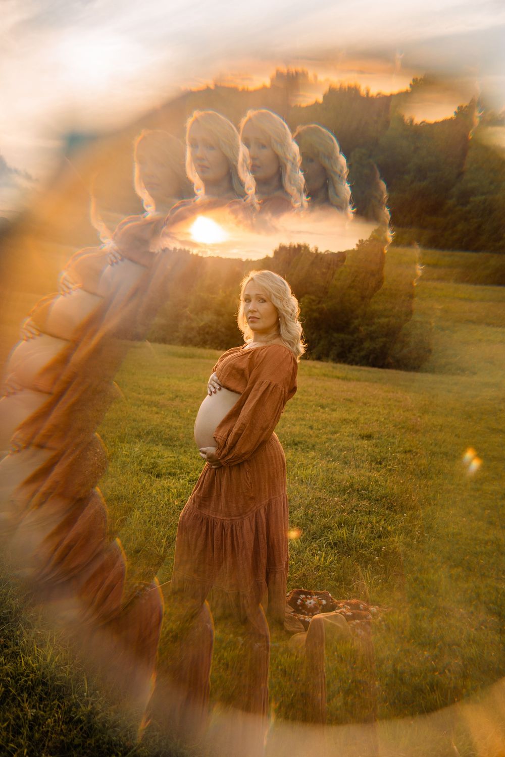 Creative maternity photo with dreamy lens reflection of pregnant woman in sunset field.