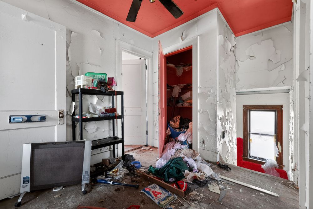 Water damage on ceiling and walls of living room in Detroit Michigan bank-owned property — condition documentation by RealtyPix