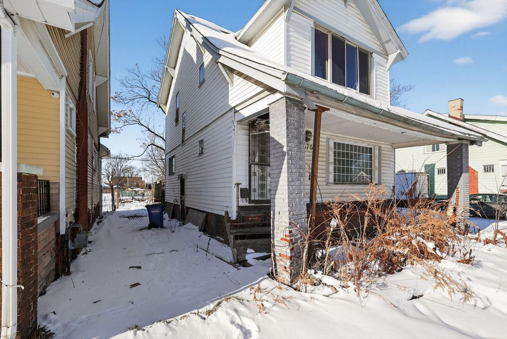 Water damage on ceiling and walls of living room in Detroit Michigan bank-owned property — condition documentation by RealtyPix