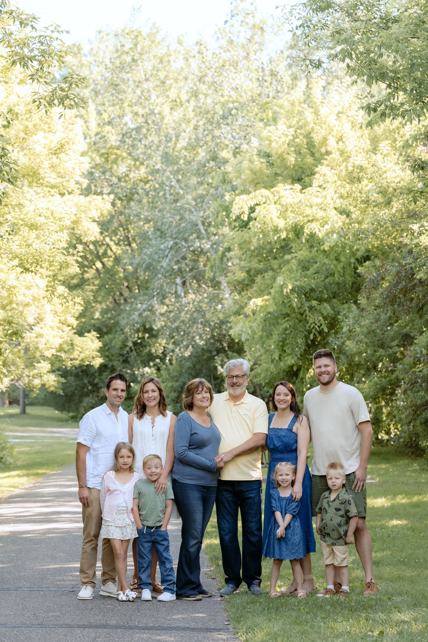 extended family three generation portrait session powers lake park in woodbury mn full portrait of the whole group surrounded by greenery