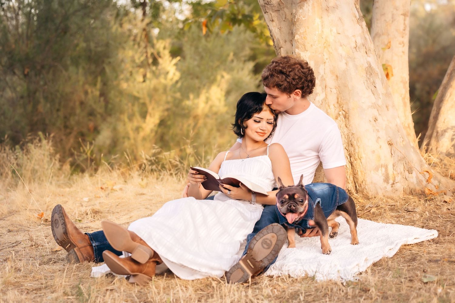 Colibri Captures catching sweet moment between young couple and fur baby near creek in Fresno,ca