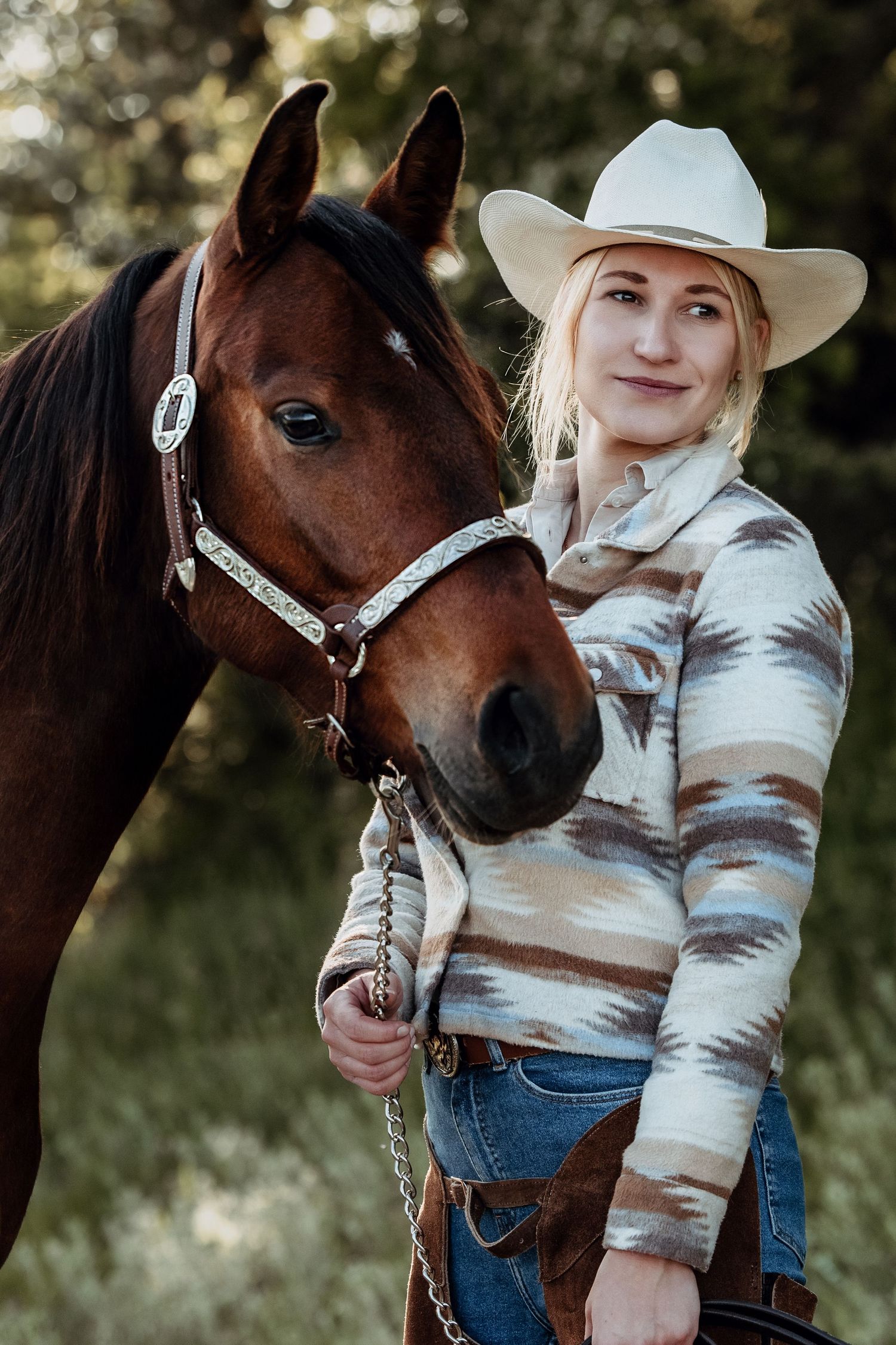 Picture of a cowgirl and her pinto horse