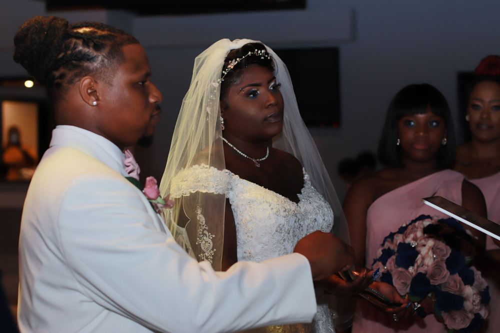Wedding portrait of bride and groom kissing. Professional portrait of a client by Talented Studios Film and Photo LLC