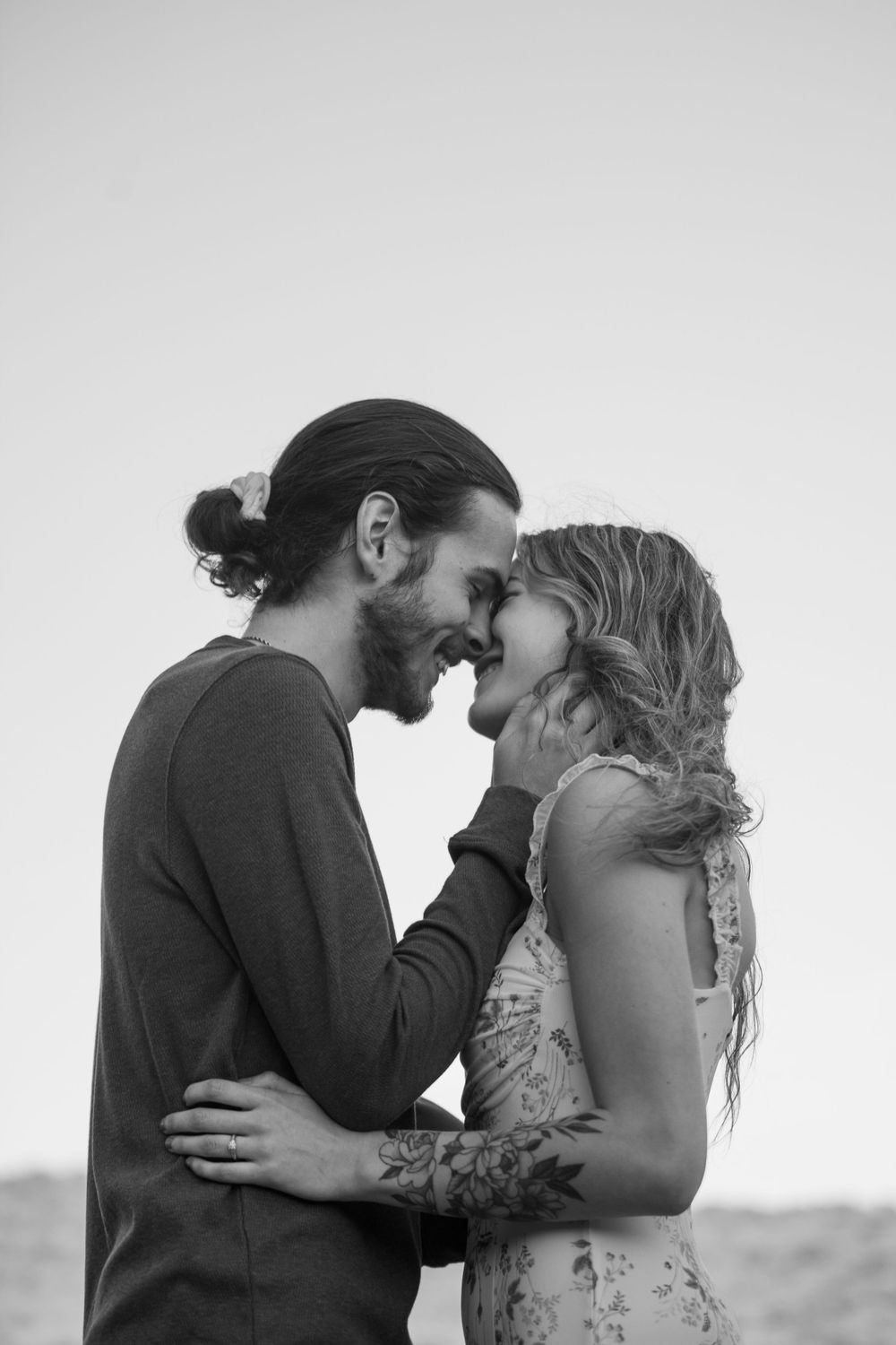 ©AnnaVonRiesenPhotography Engagement Portrait | B&W image of a couple holding each other before going in for a kiss