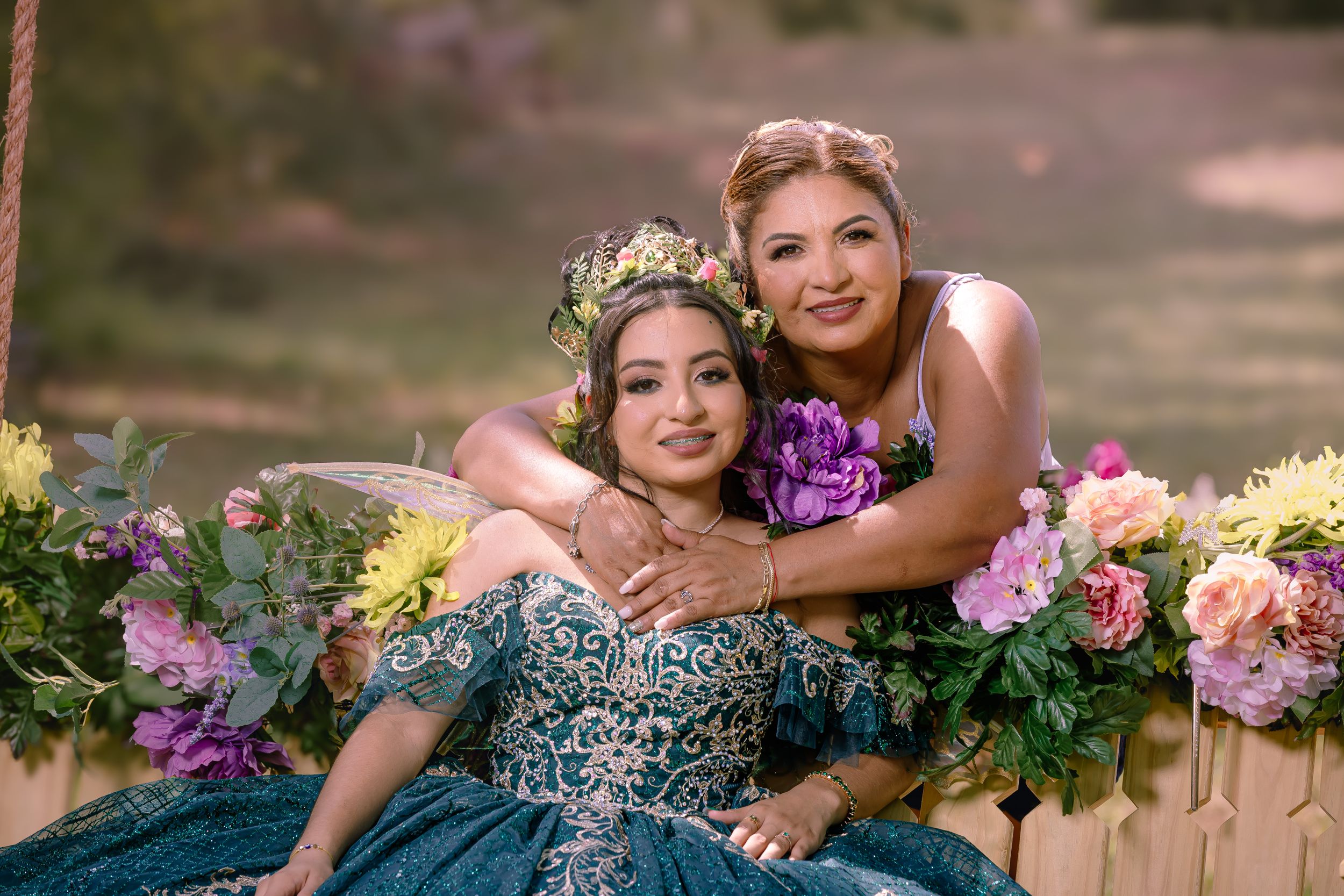 Enchanting portrait series with vibrant floral arrangements and an ornate swing setting.