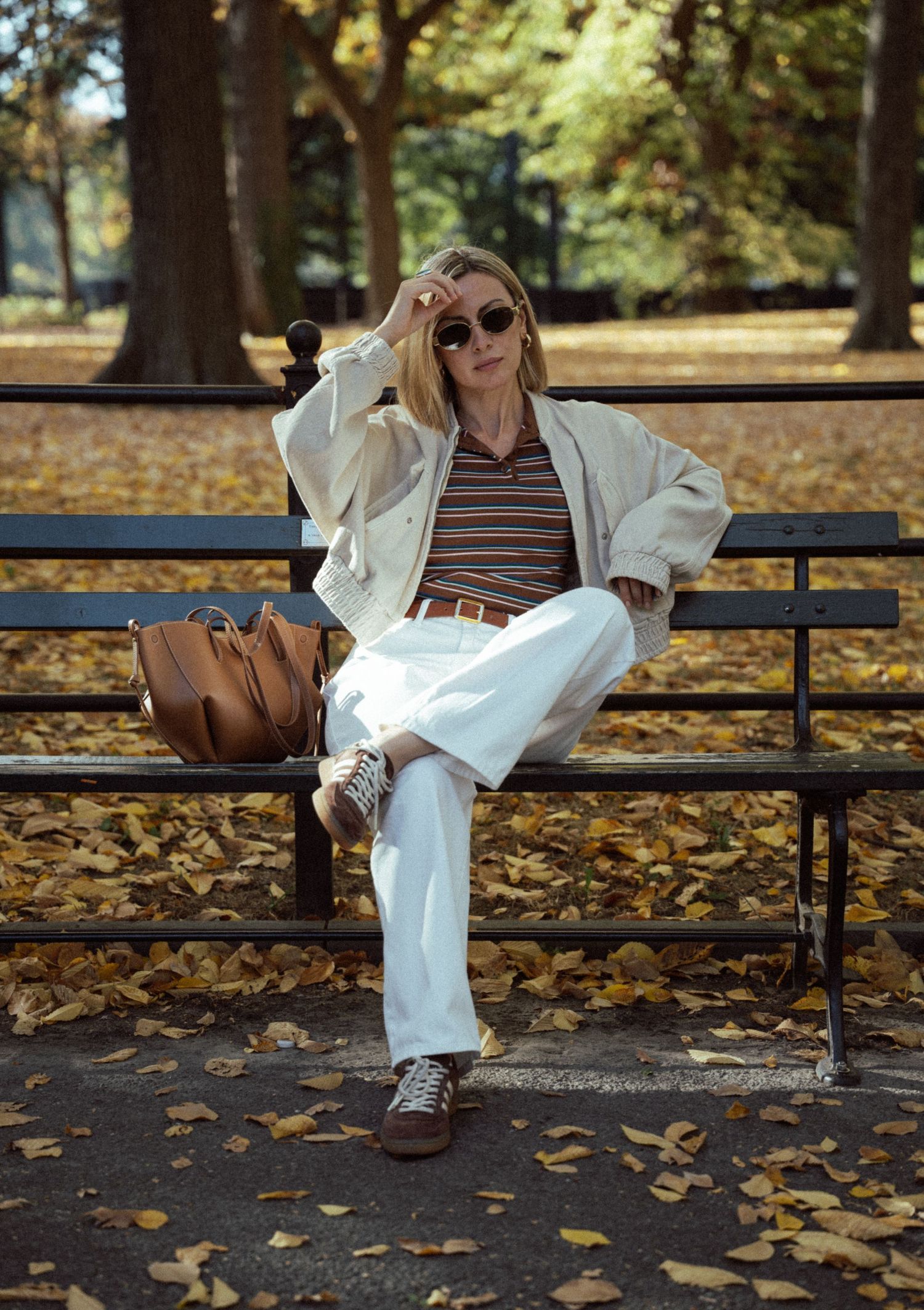 An ethereal, cinematic portrait of a beautiful woman in Central Park—timeless elegance meets New York’s natural charm