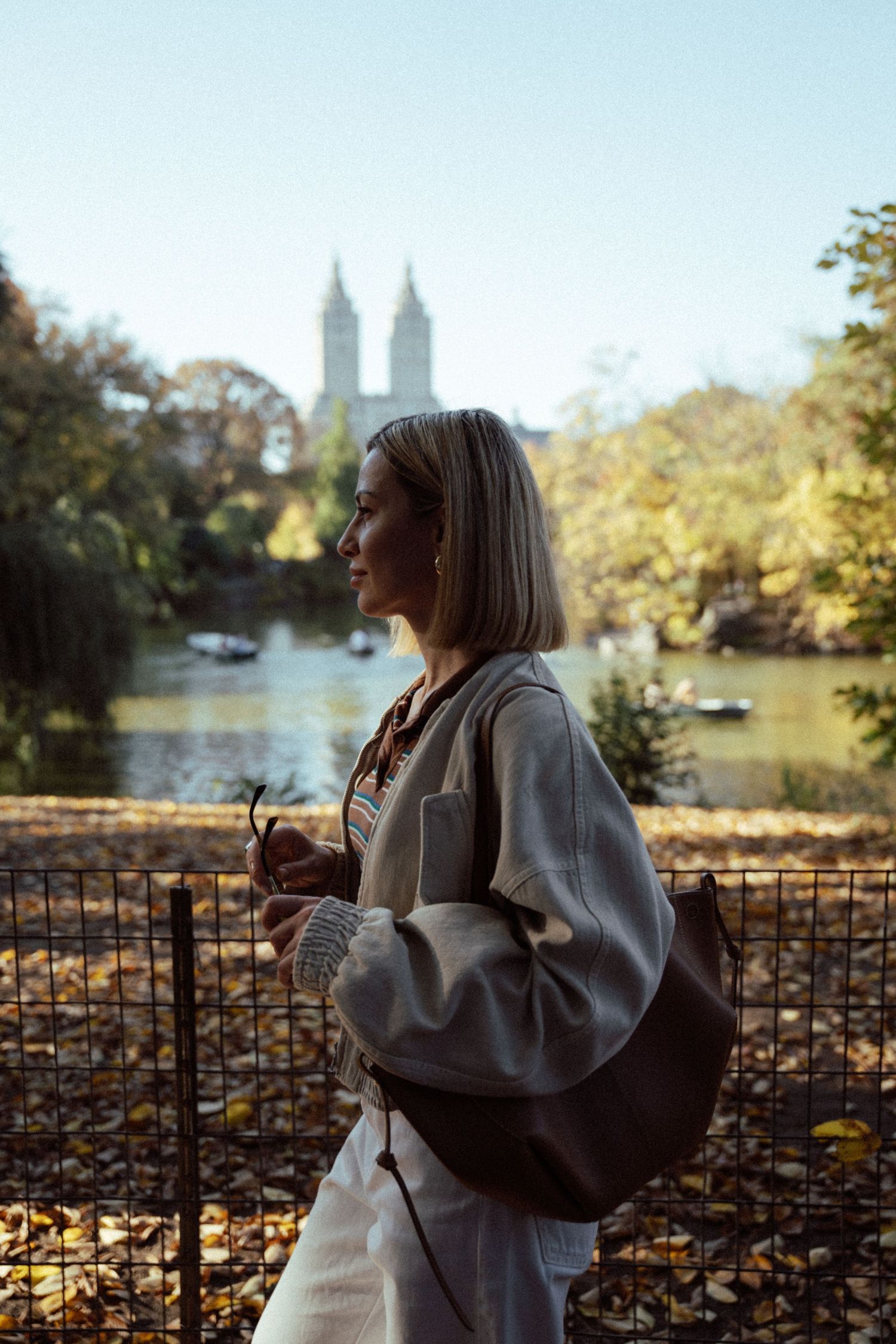 An ethereal, cinematic portrait of a beautiful woman in Central Park—timeless elegance meets New York’s natural charm