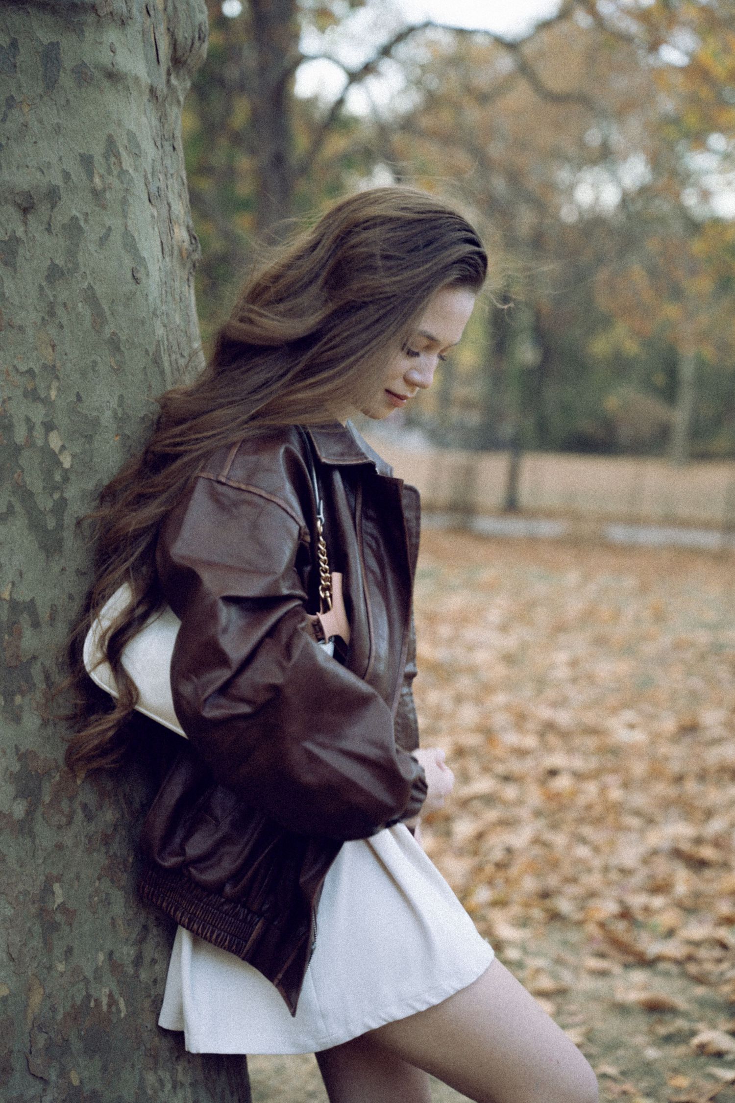 An ethereal, cinematic portrait of a beautiful woman in Central Park—timeless elegance meets New York’s natural charm