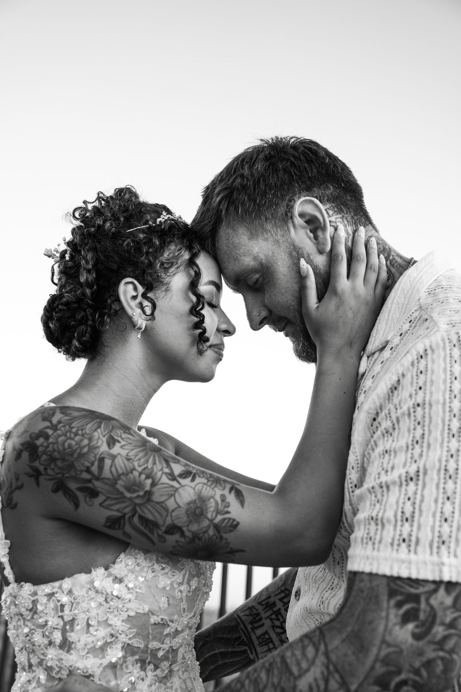 A series of intimate black and white portraits showing a romantic couple sharing tender moments together.
