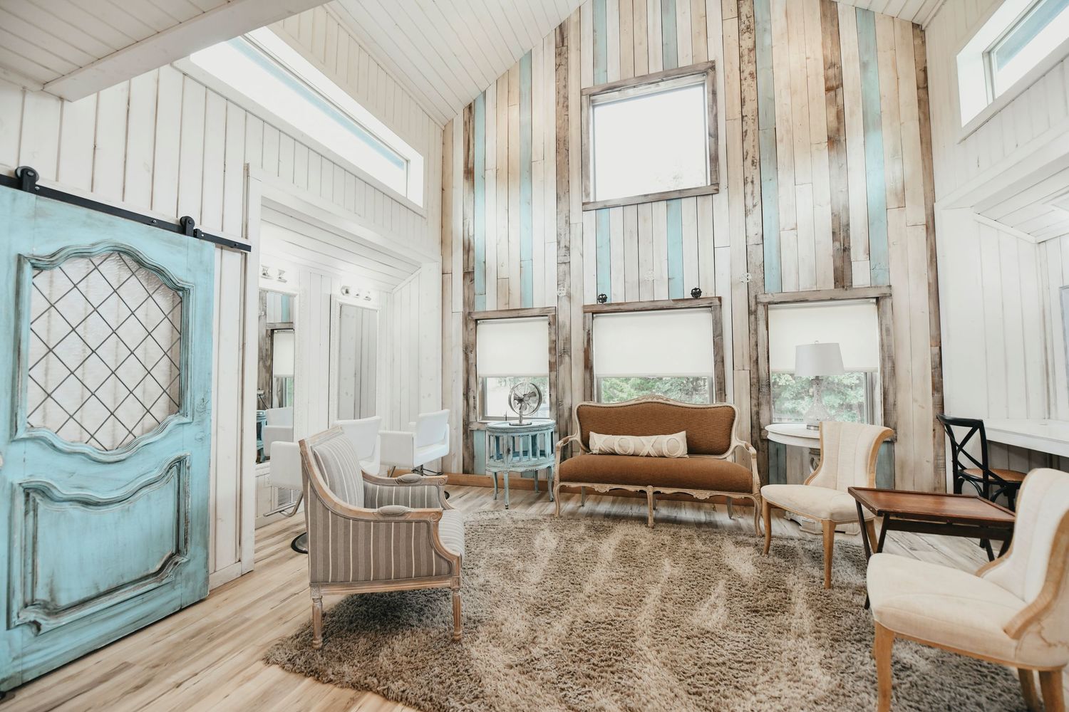 Bridal suite with chic blue shiplap walls and rustic-modern details inside whispering oaks wedding venue