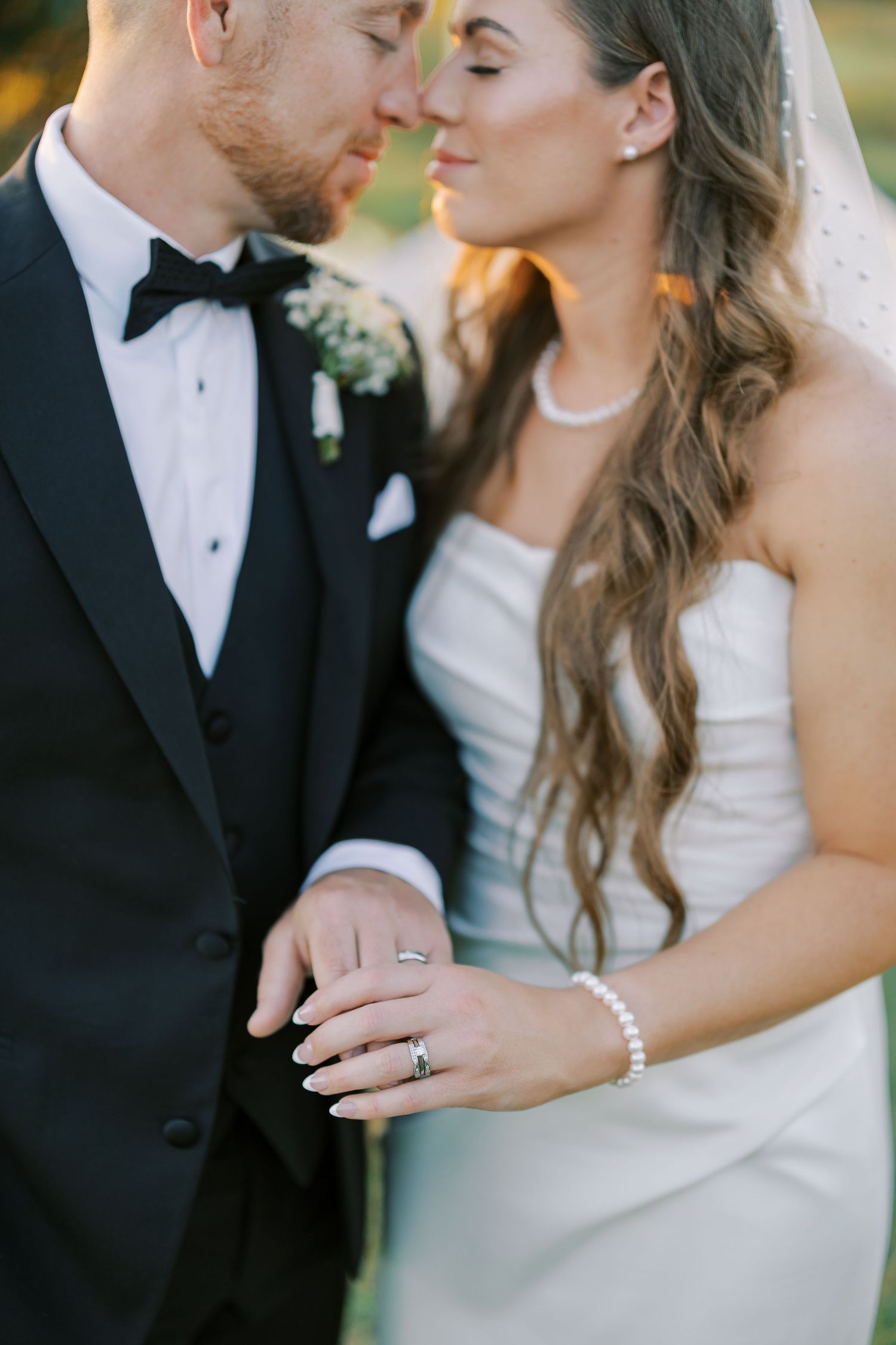 A series of intimate wedding photos showing rings, romantic moments, and close-ups of newlyweds in elegant attire.