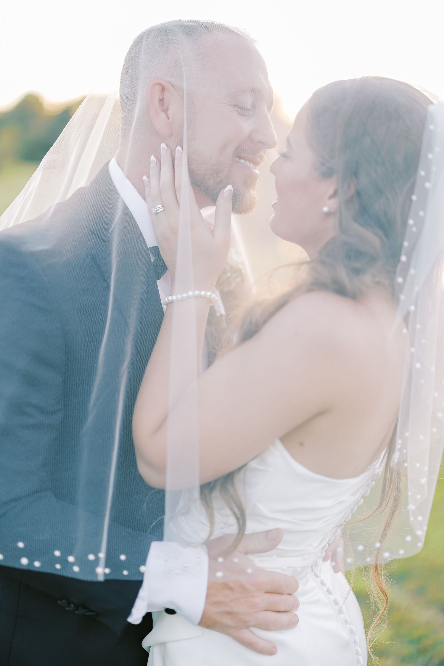Romantic wedding photography series capturing tender moments between newlyweds in soft sunlight.