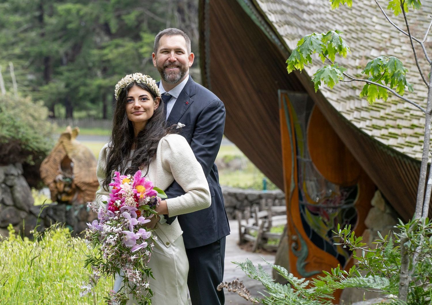 A couple poses outdoors during their wedding at The Sea Ranch Chapel.