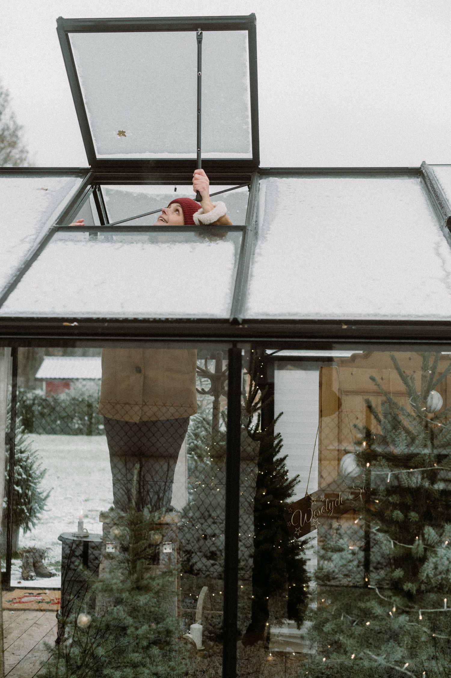 A sequence of photos showing an exterior window being opened from various angles during a snowy winter day.