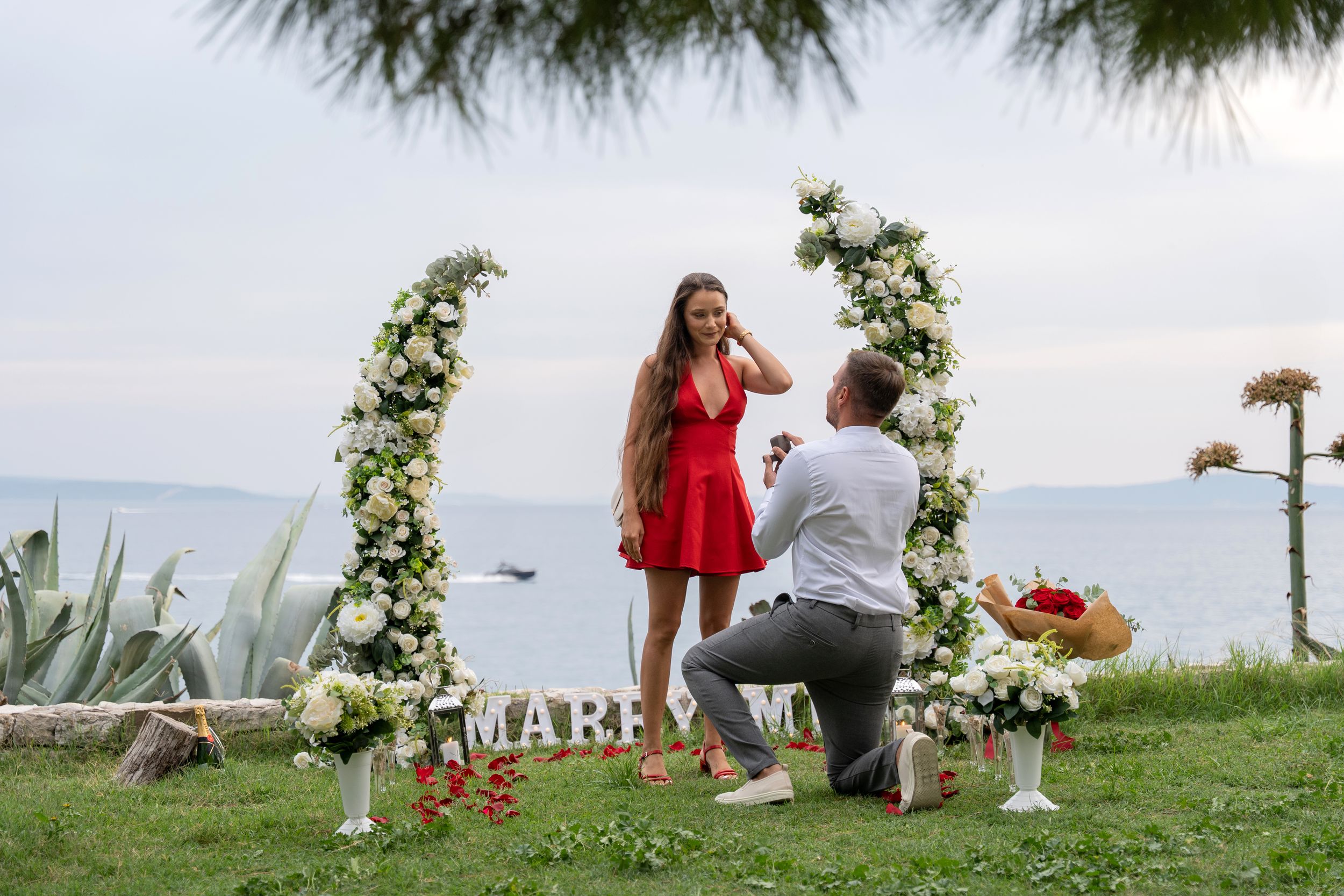 Surprise proposal in Split Croatia with flower arch Marry me