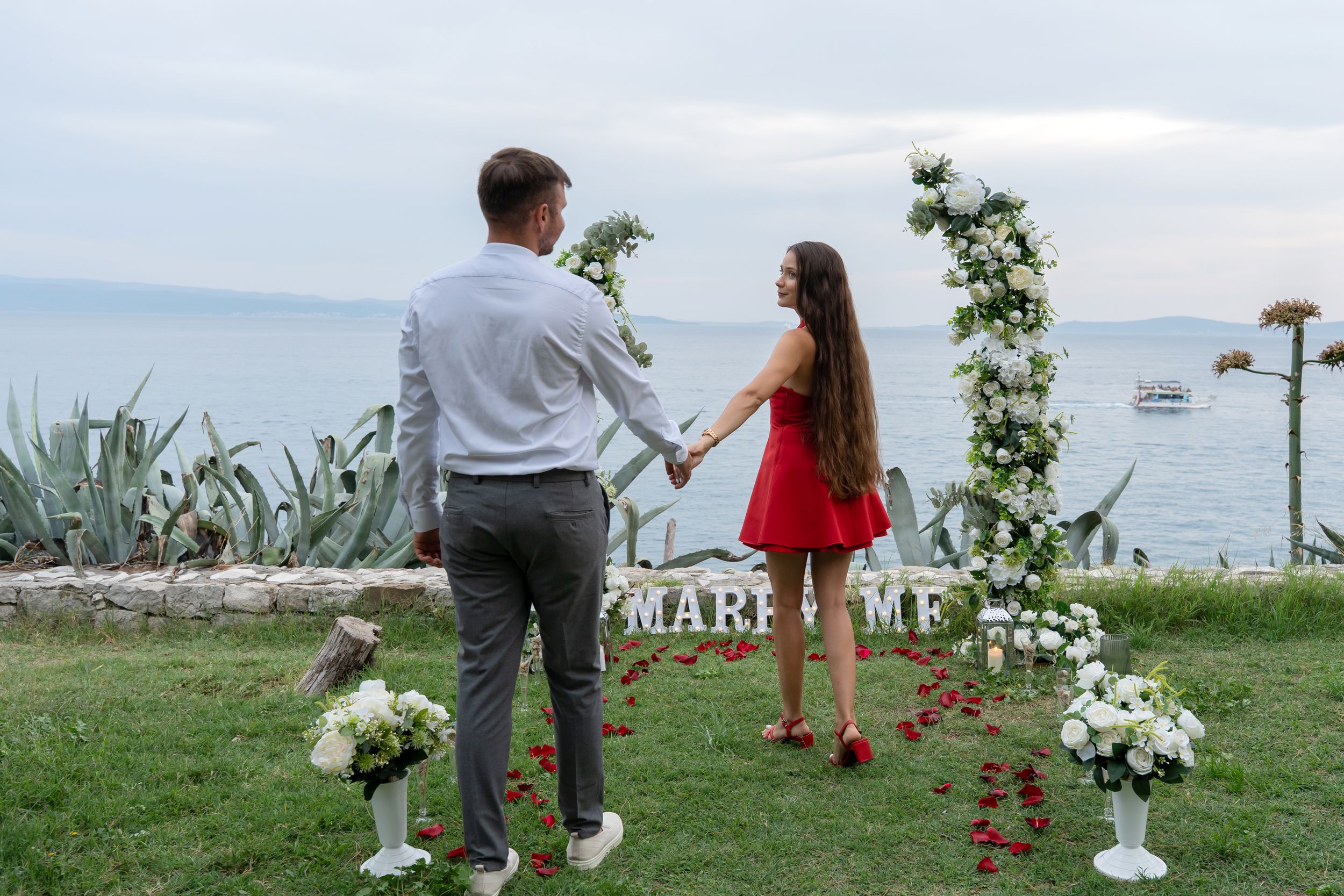 Surprise proposal in Split Croatia with flower arch Marry me