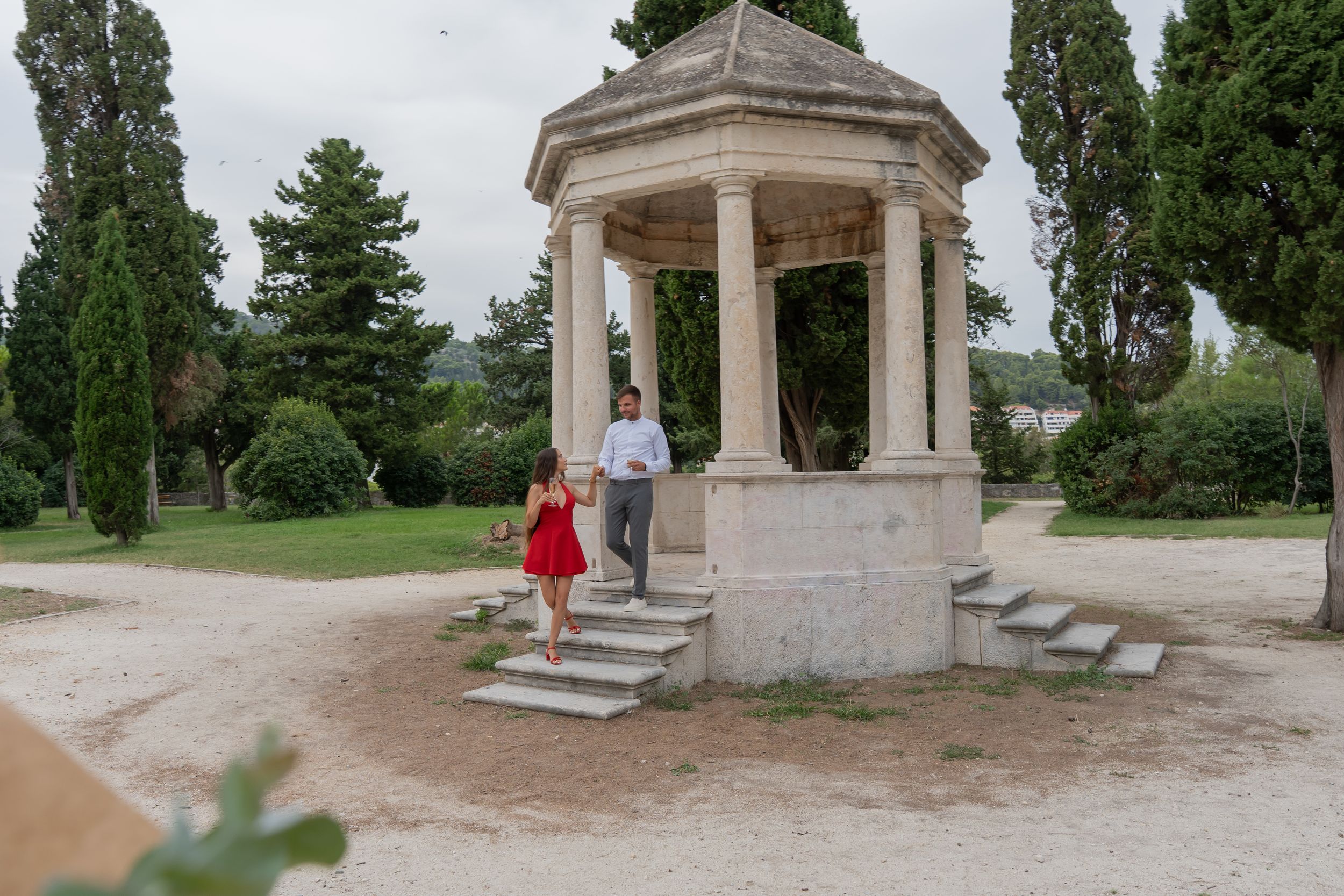 Surprise proposal in Split Croatia with flower arch Marry me