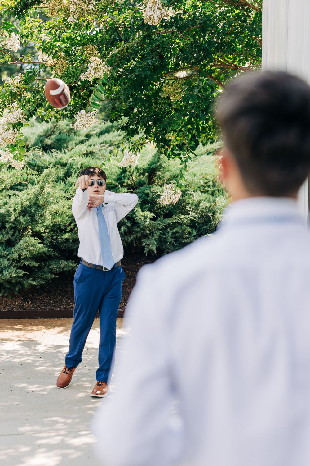A playful ring toss game sequence showing motion as someone throws rings outdoors on a sunny day.