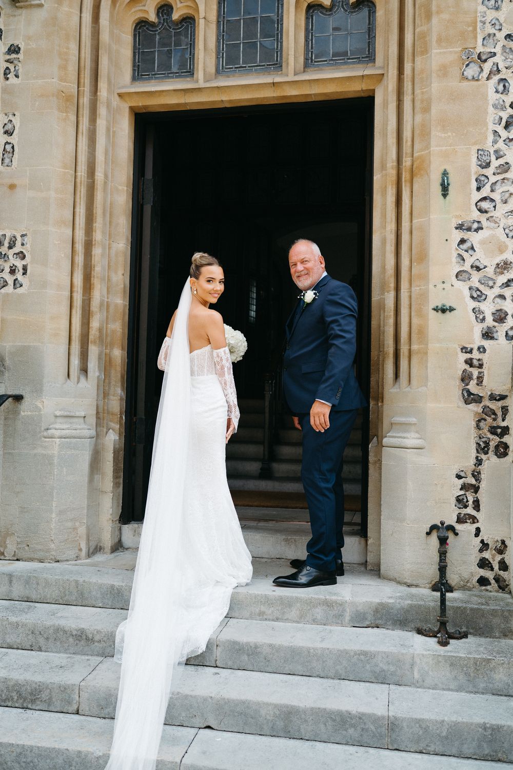 Four photos showing a sequence at stone church entrance with wedding party members in formal attire.