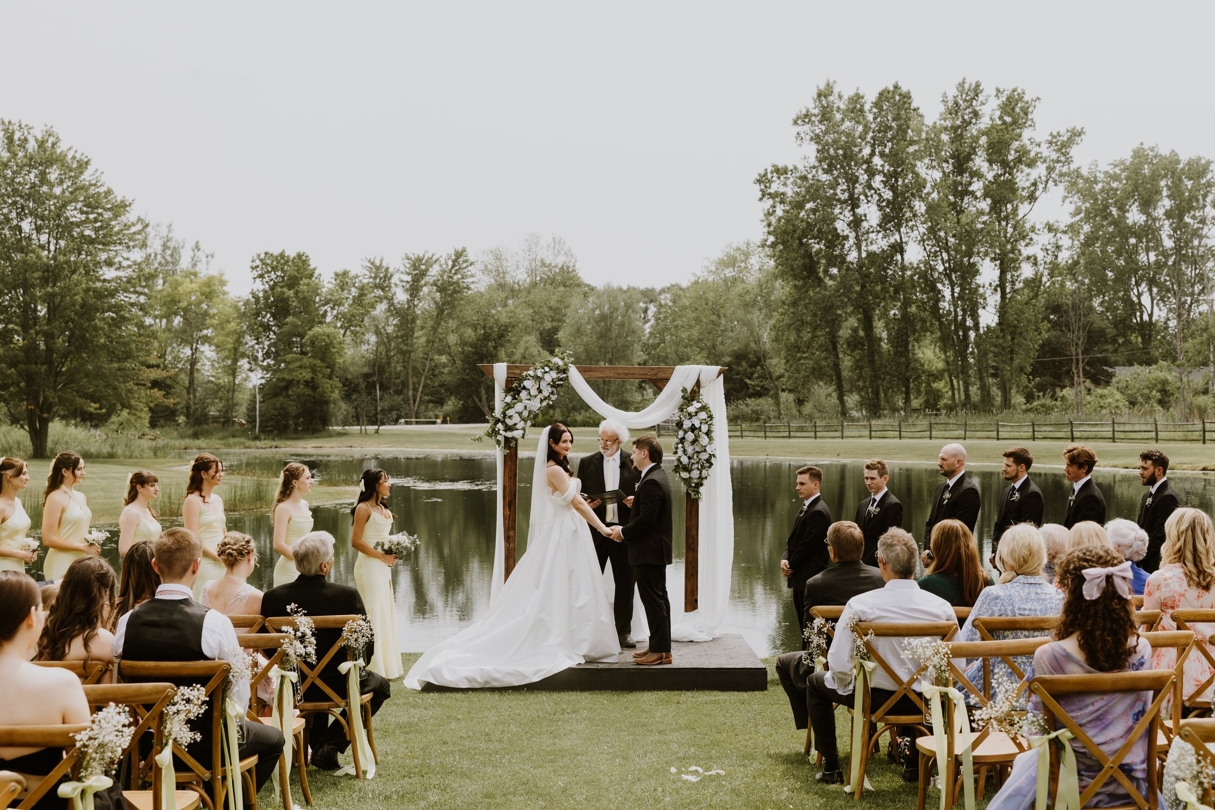 Bride and groom ceremony photos from summer wedding at home in Pinckney, Michigan. Intimate backyard wedding captured by Lindsay McDow Photo