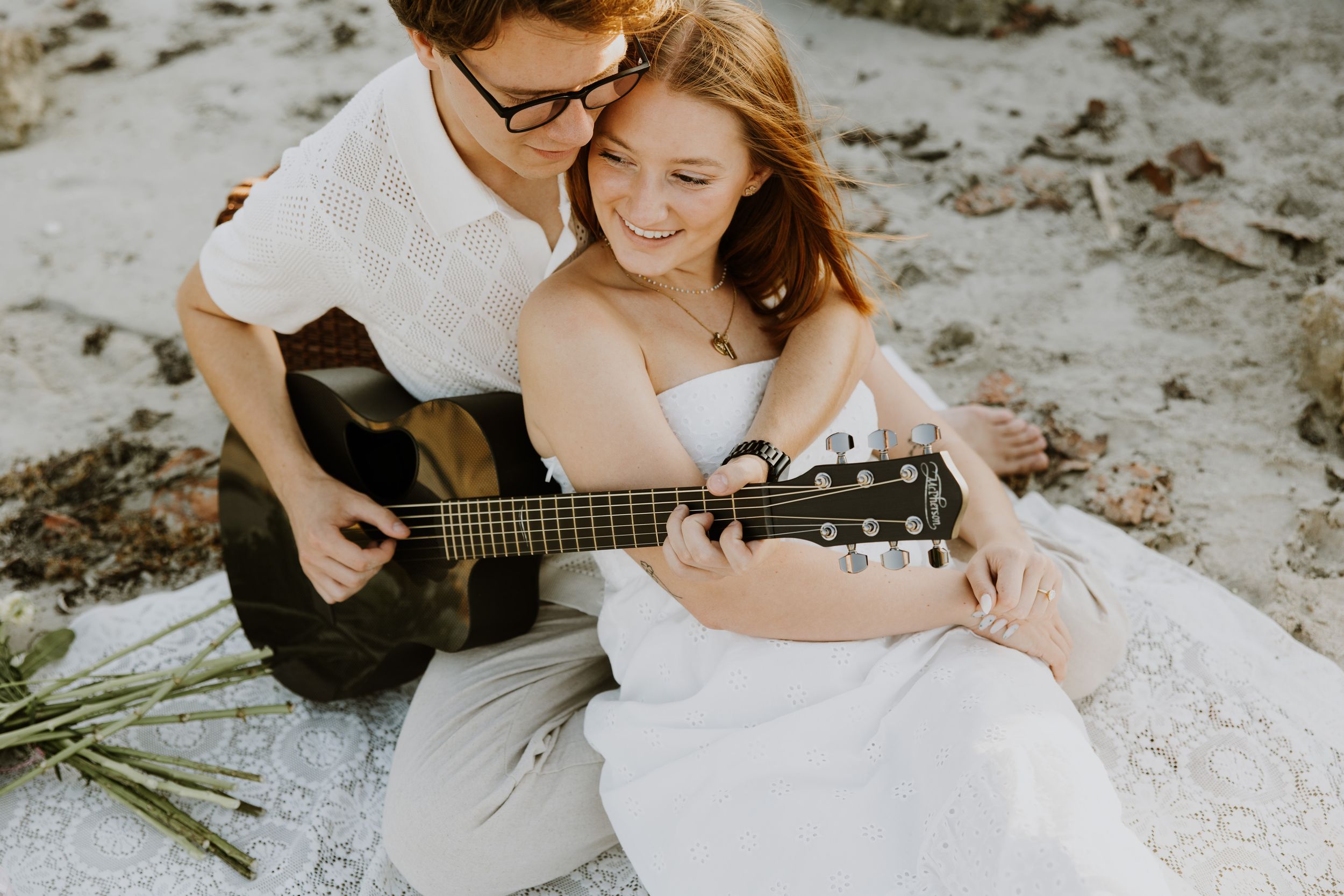 Golden Hour engagement photos of a couple on the beach at Dubois Park in Jupiter, Florida captured by Lindsay McDow Photography
