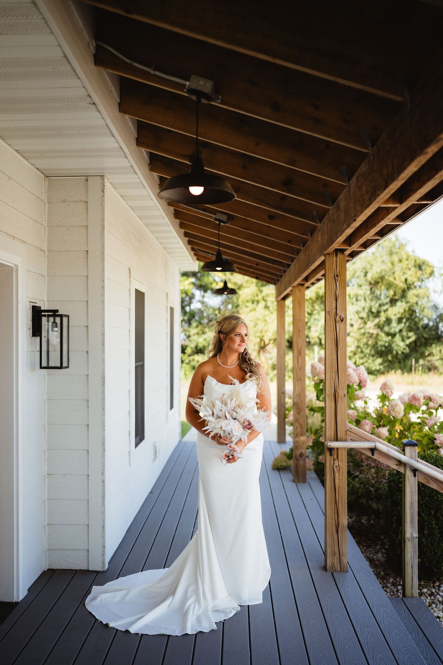 A bridal portrait series showing a wedding dress movement sequence against a white porch backdrop.