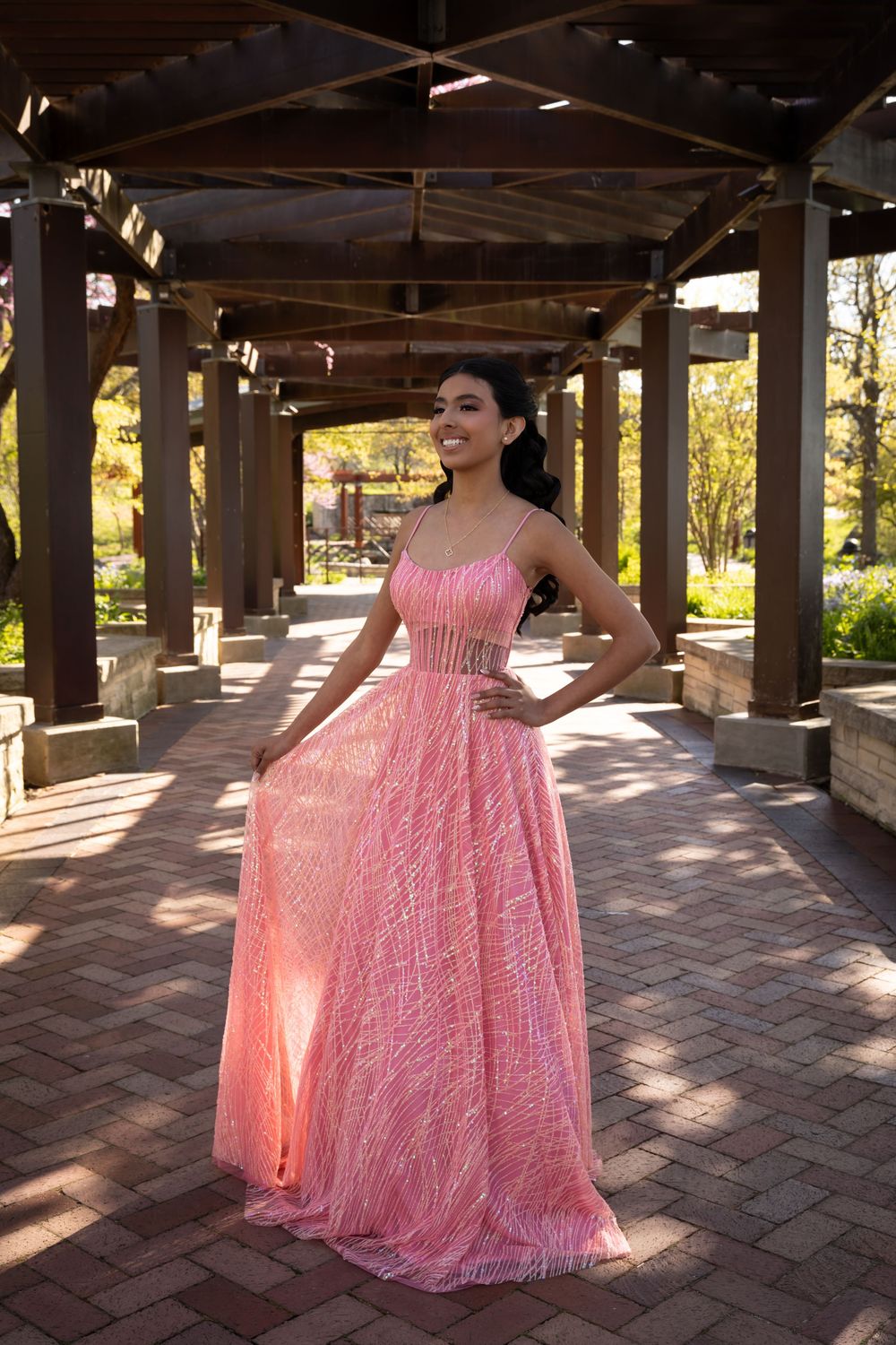Back view of a pink Sweet 16 ballgown featuring a long flowing train. Creative outdoor event photography in Libertyville by Alex T.