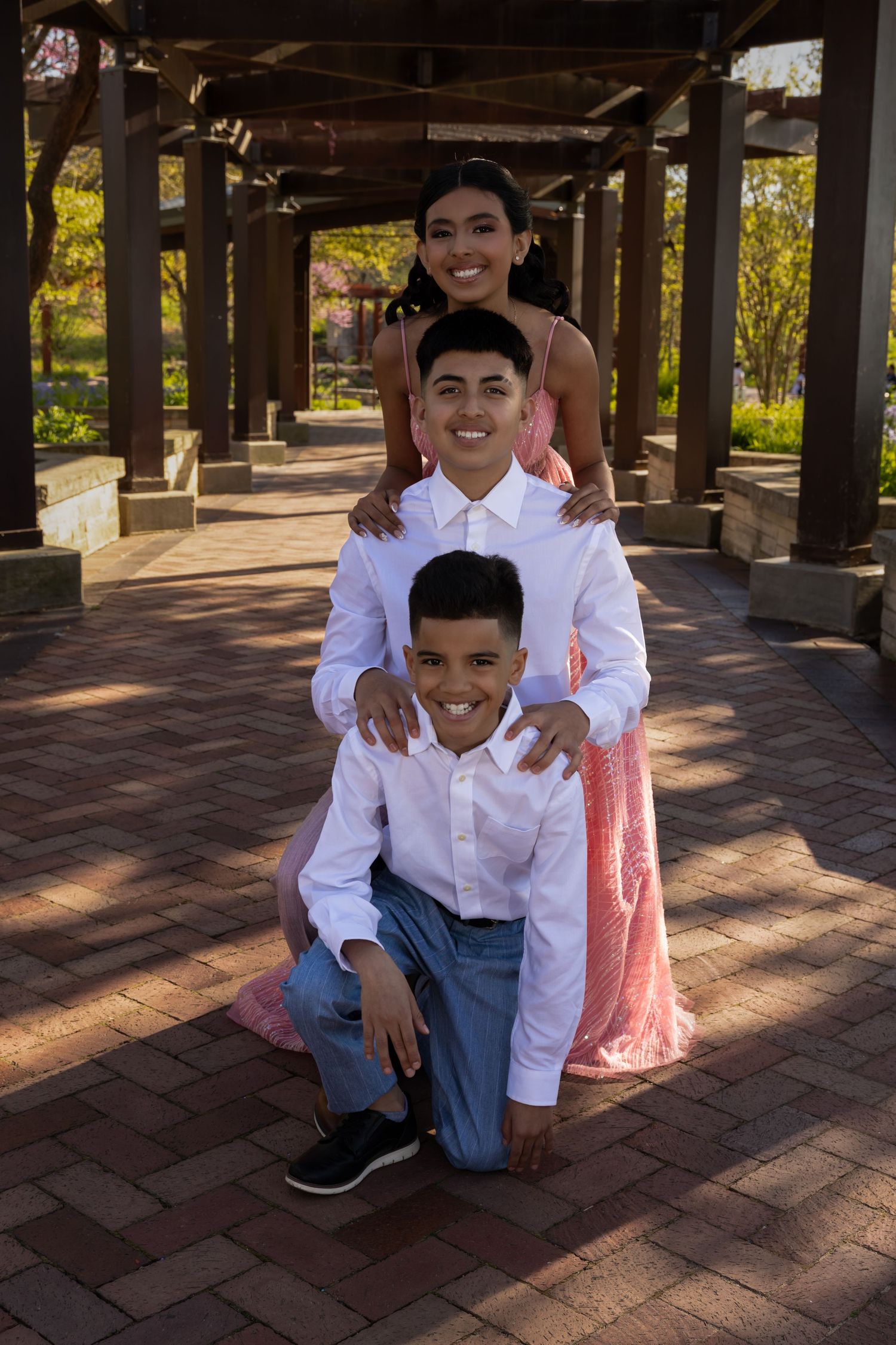 Creative stacked family portrait under a wooden garden structure. Unique and fun family session ideas in Lake County by Alex T Photography.
