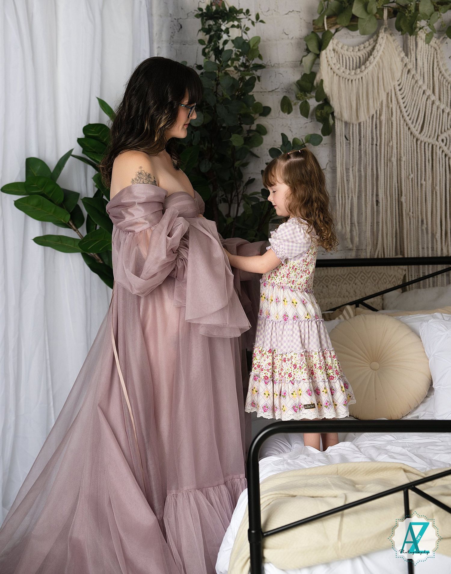 Multiple angles of a mauve dress and floral children's dress photographed in a bohemian styled room setting.