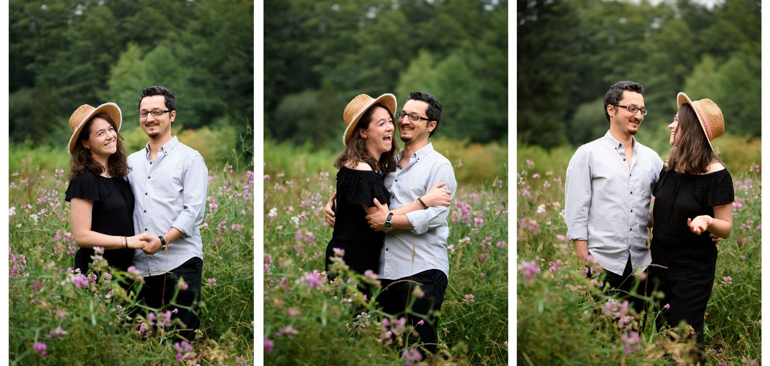 A couple shares intimate moments together in a lush green outdoor setting during a photo session.