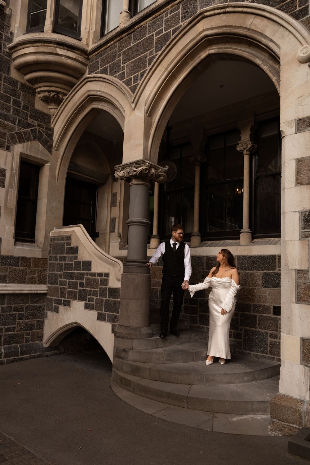 Newlyweds holding hands during elopement session in Christchurch city