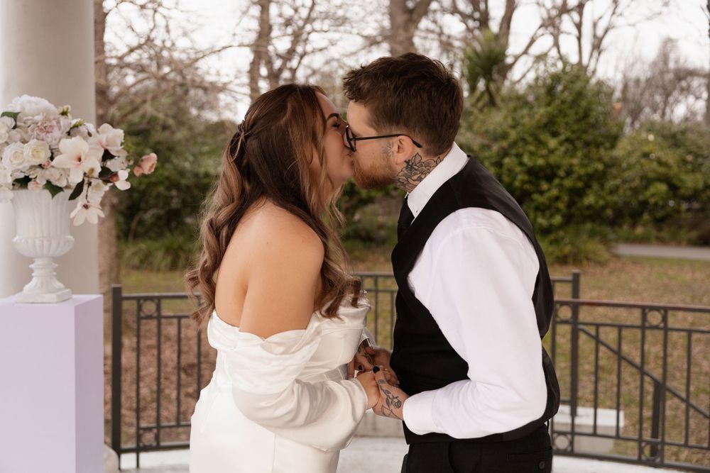couple kissing after saying "I do" during elopement session in christchurch
