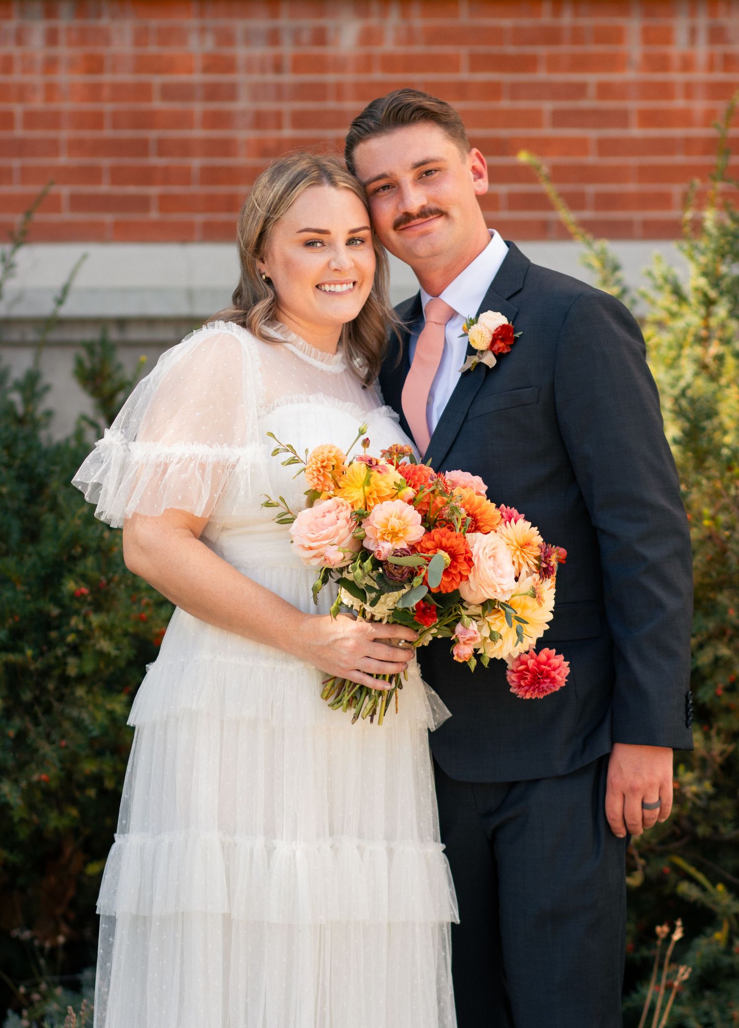 Bride and groom smiling after intimate court wedding