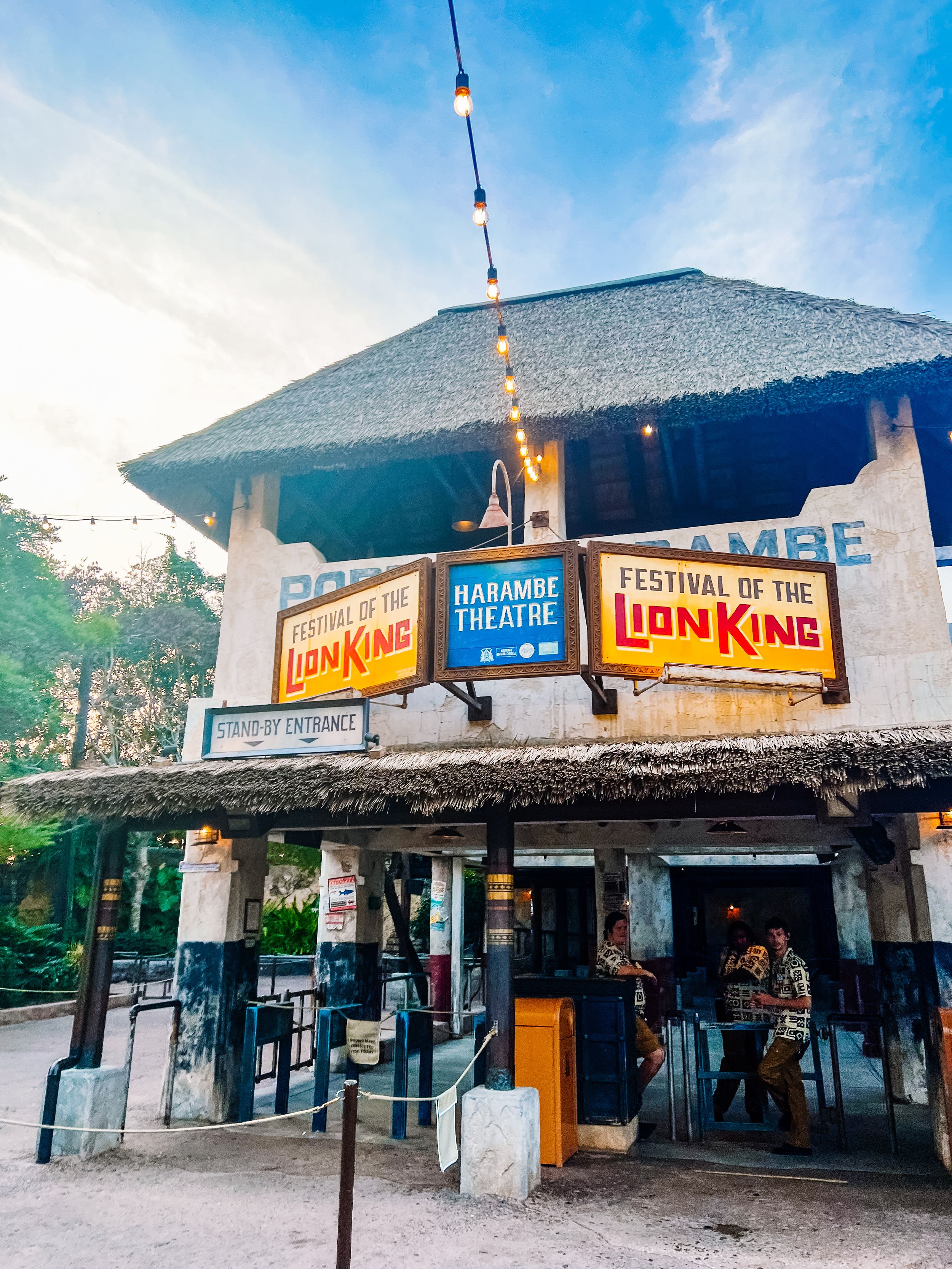 Festival of the Lion King theatre entrance with promotional signs at Disney's Animal Kingdom theme park.