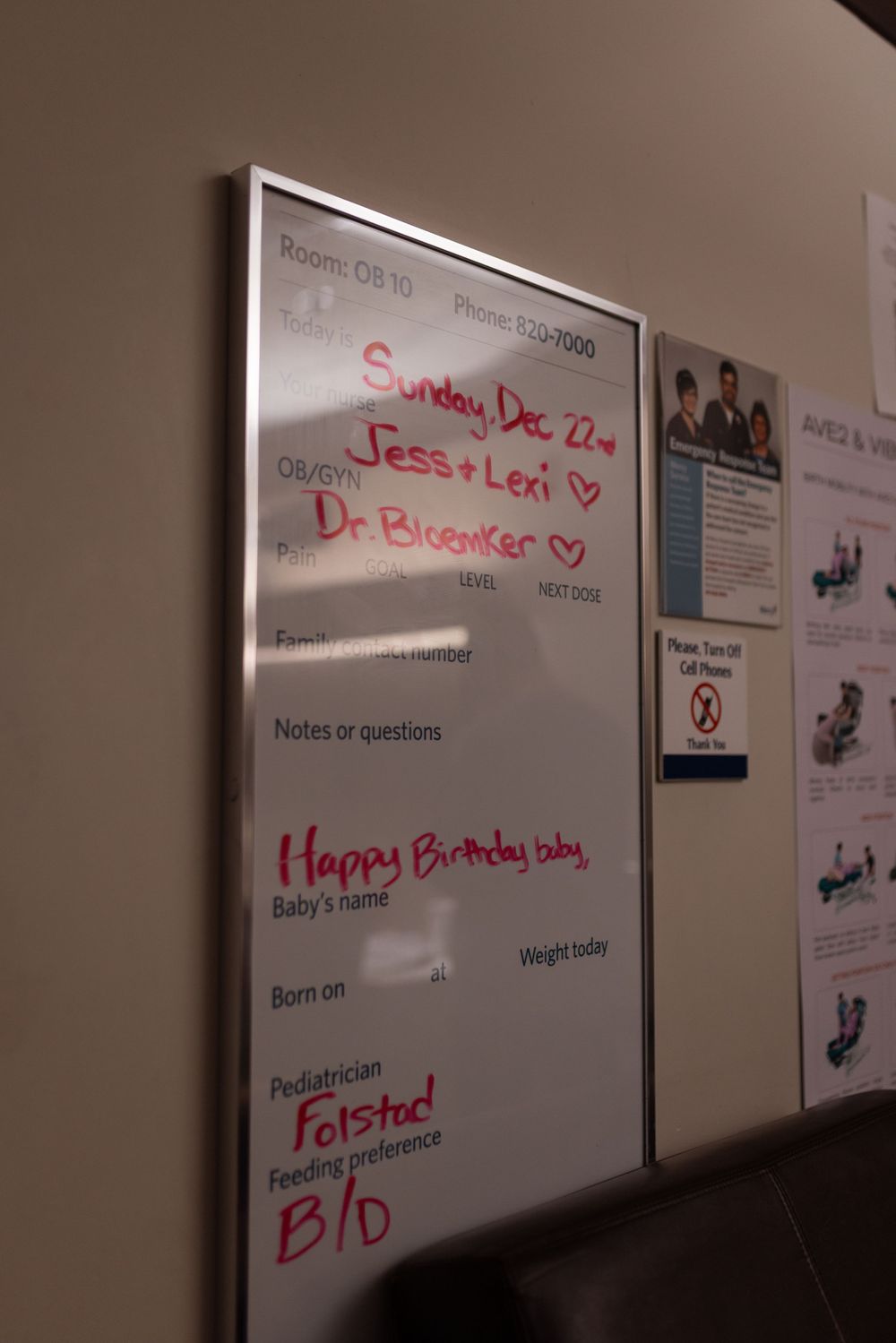 White dry erase board mounted on wall with handwritten text in red and black markers showing notes and reminders.