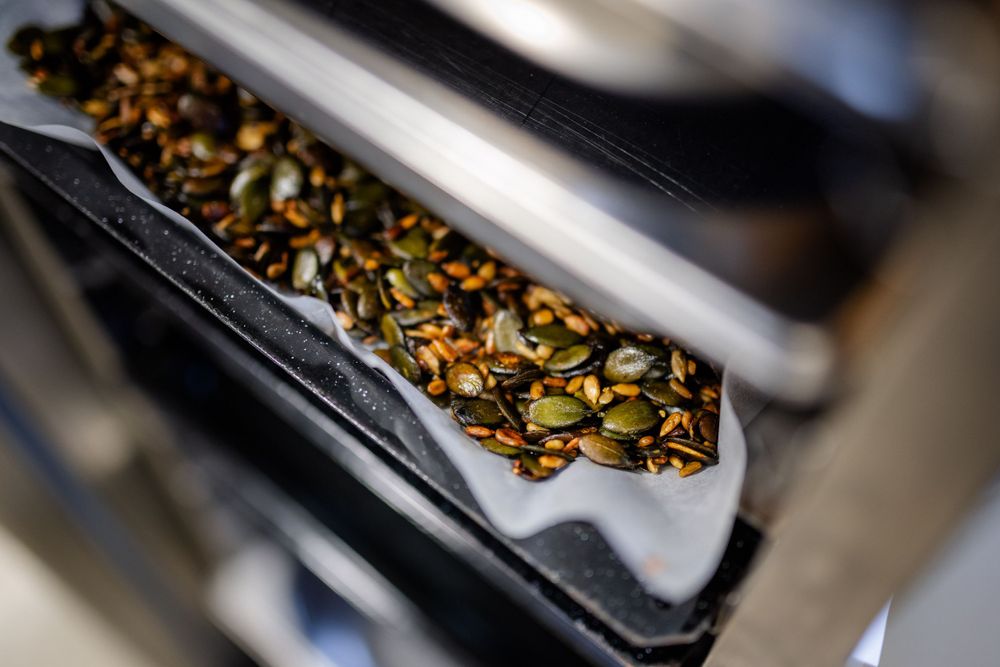 Close-up of loose tea leaves in a metal container.