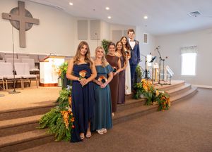 A sequence of photos showing a church interior with people in blue dresses standing near floral arrangements and wooden pews.