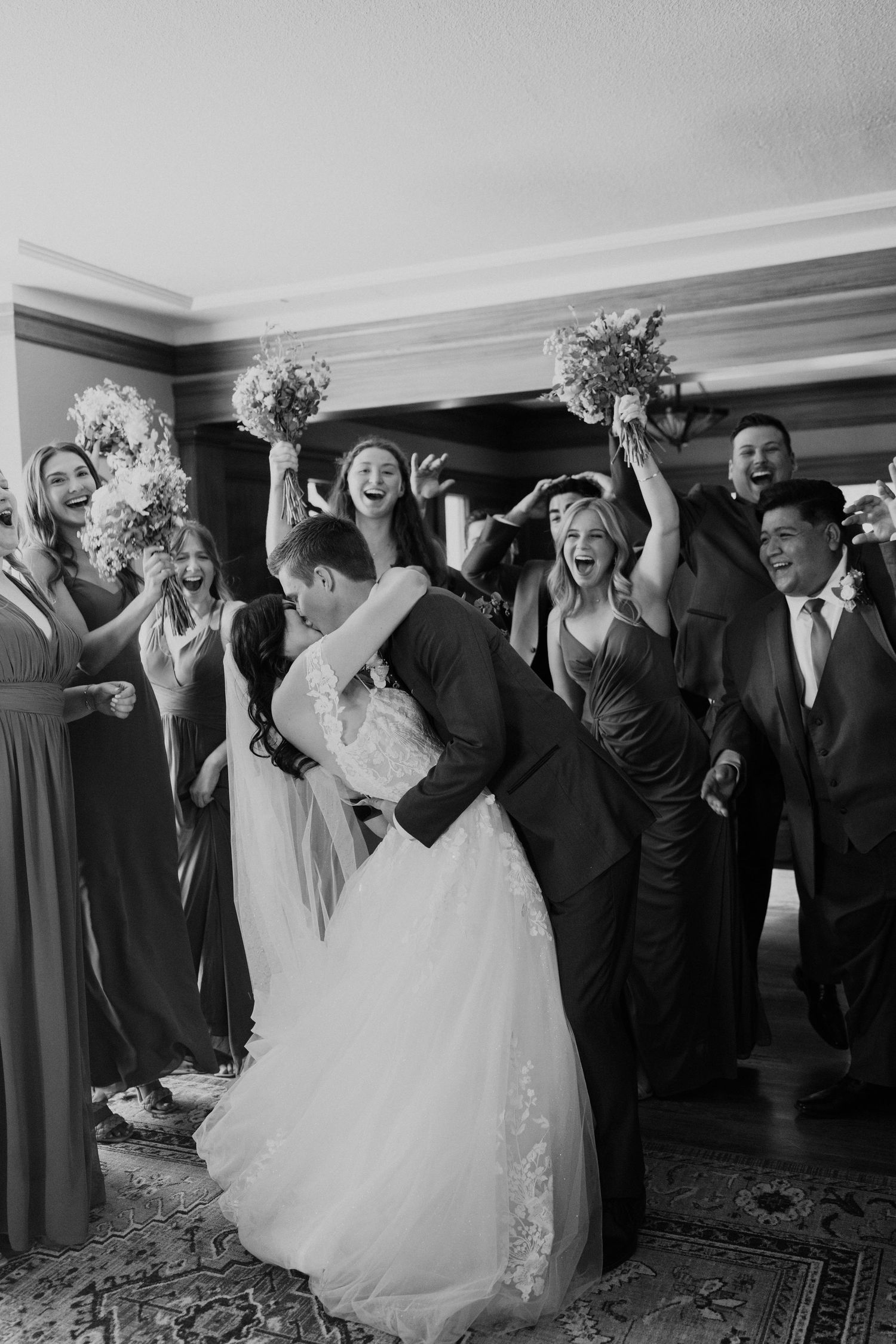A celebration scene shows wedding party members cheering during a reception.
