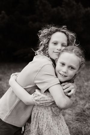 siblings hugging each other during family session at Bottle Lake Forest, christchurch