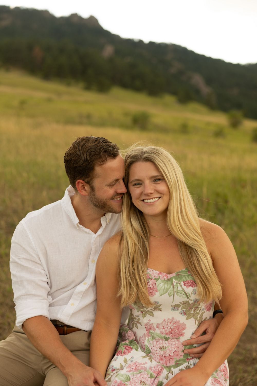 An intimate portrait in a mountain meadow with the Colorado foothills creating a natural backdrop.