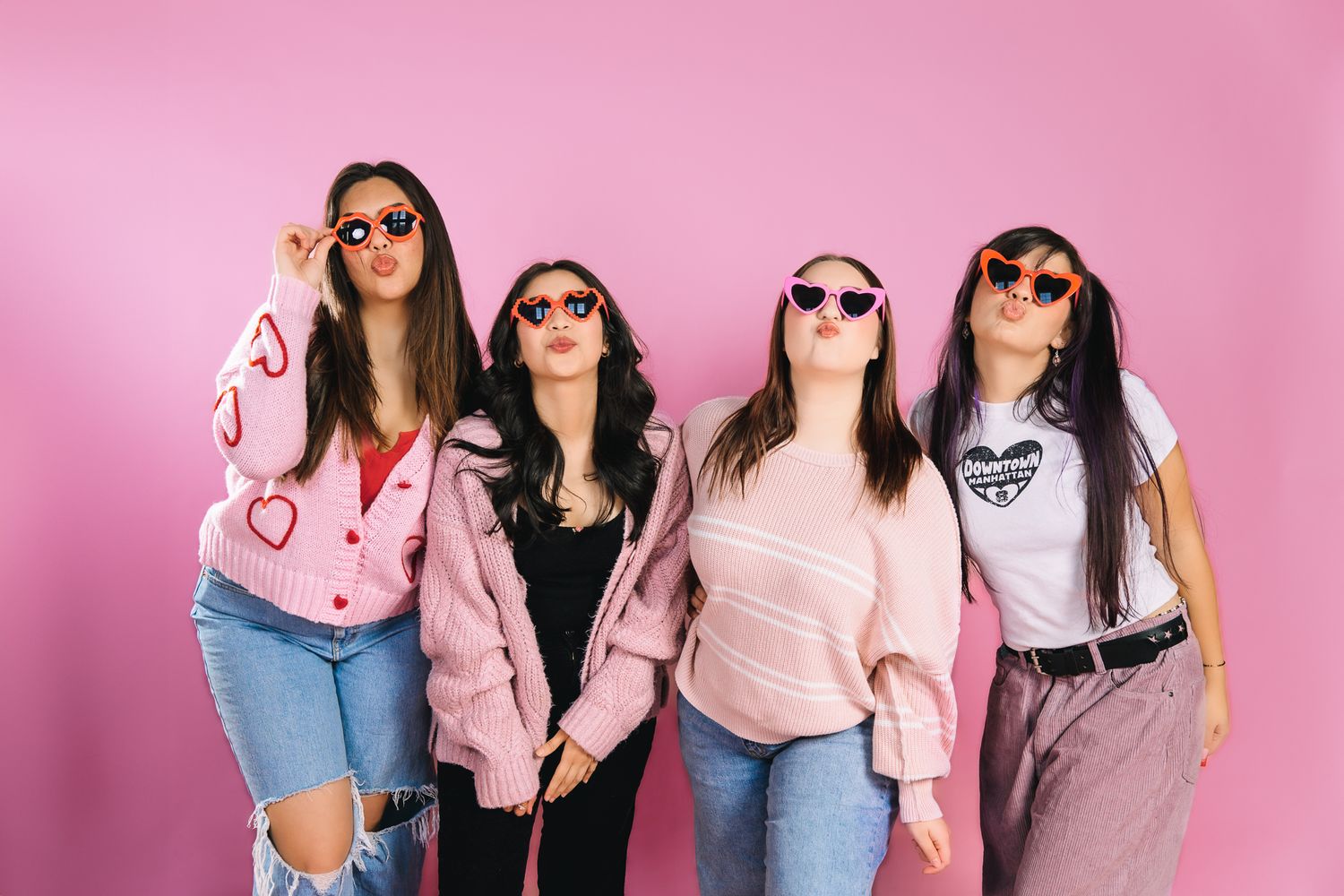 valentines day mini photoshoot. gelntines day photoshoot with friends. pink backdrop and 4 friends kissing. 4 best friends photoshoot.