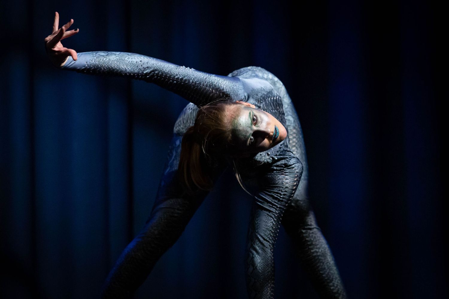event photography Photo of a circus performer Brighton wearing a snakeskin leotard on stage
