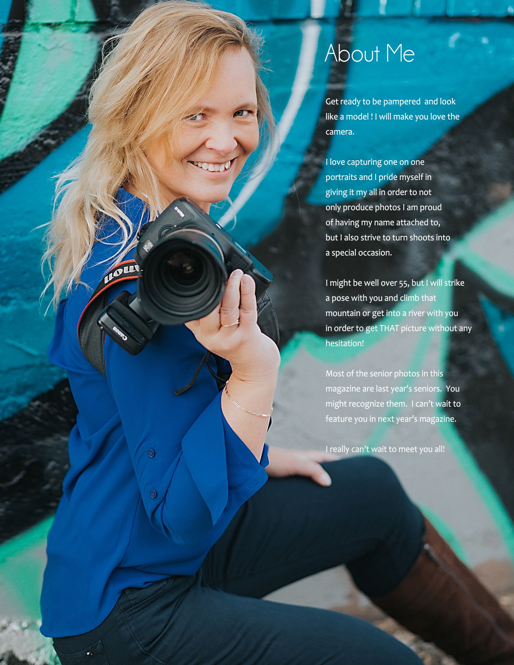 Professional photographer in blue jacket holds camera against vibrant turquoise wall background in lifestyle photoshoot.