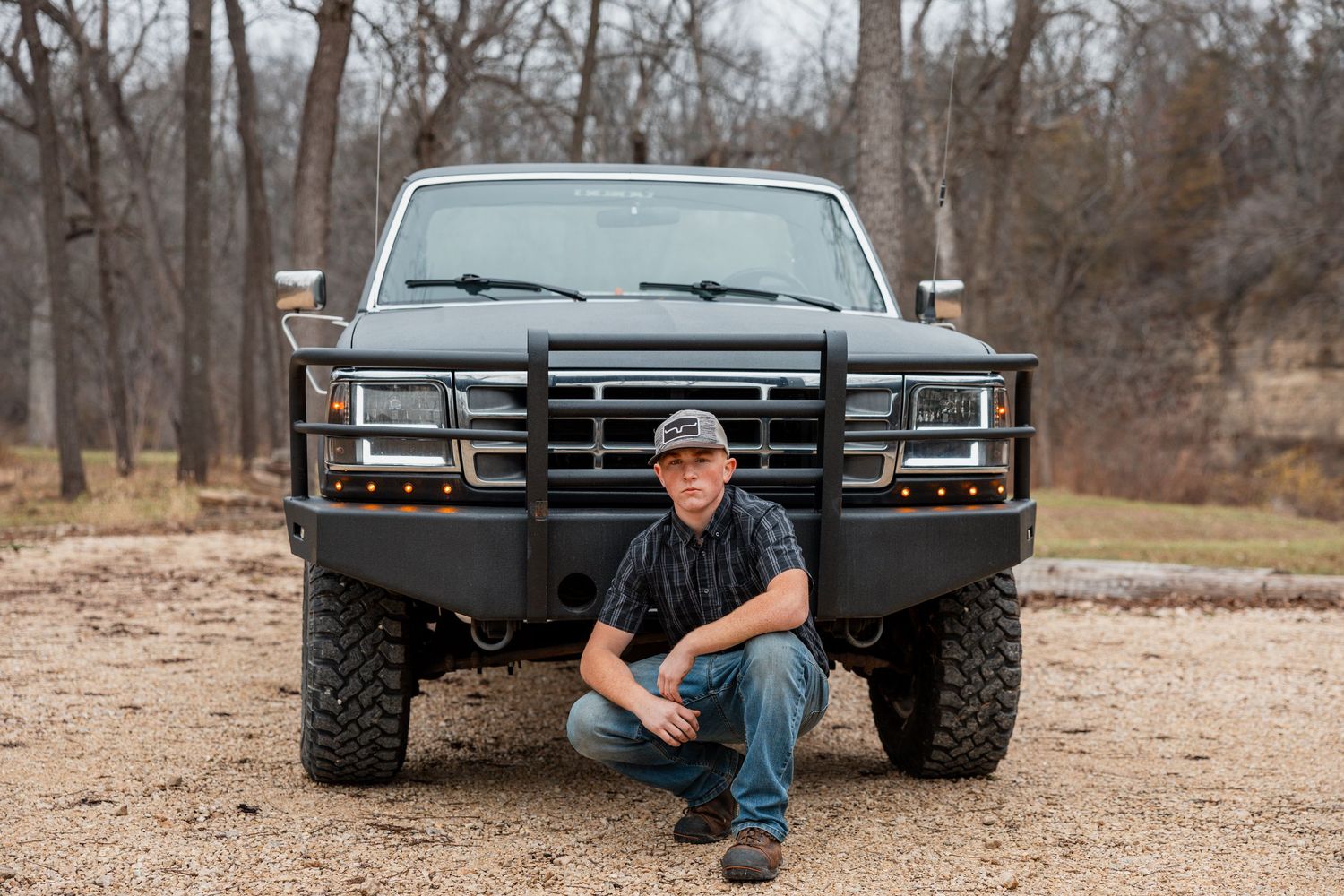 A series of casual portraits showing someone posing next to a black pickup truck in a rural outdoor setting.