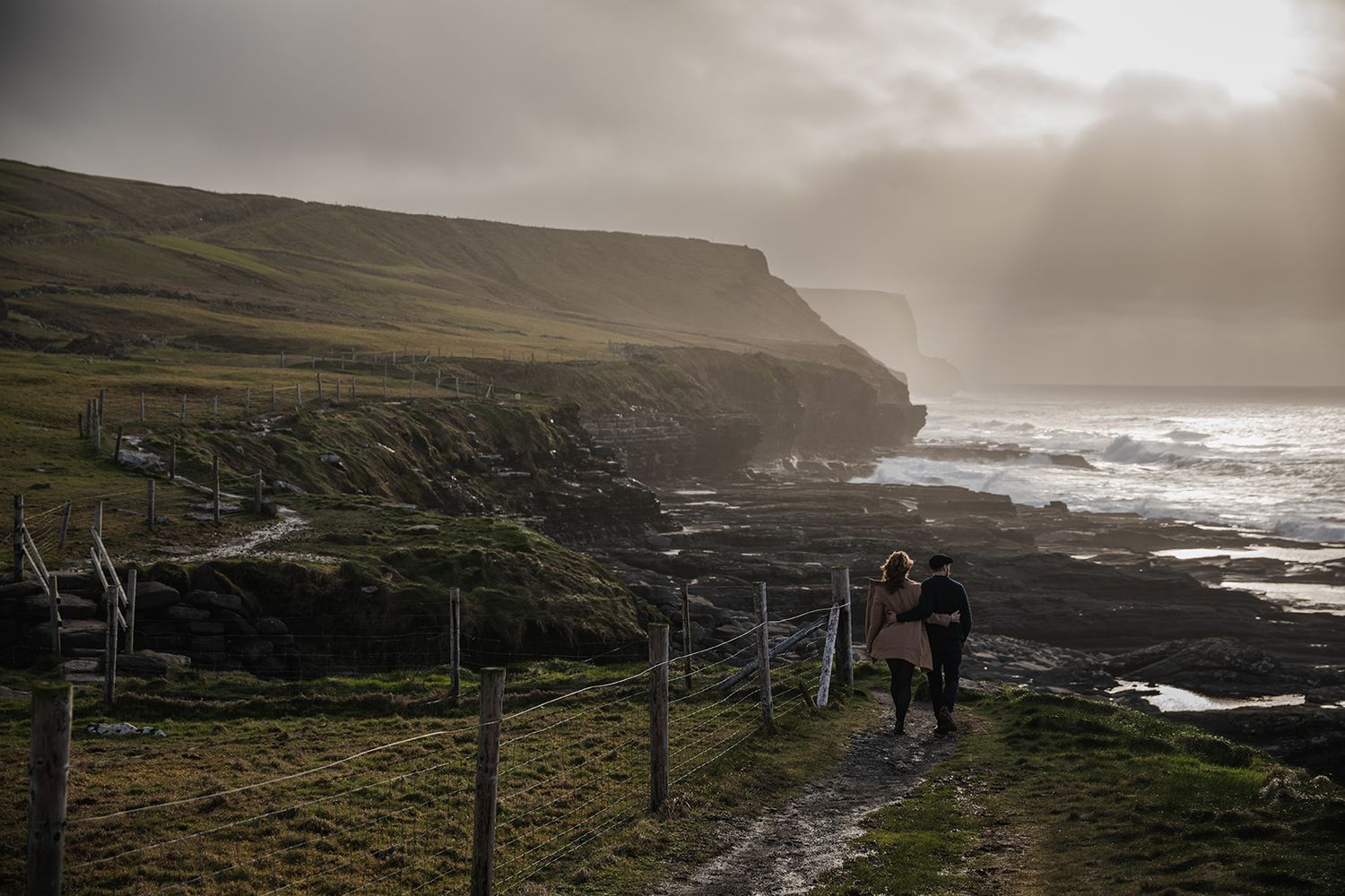 Romantic cinematic couple session during golden hour at Doolin Cliff Walk in County Clare