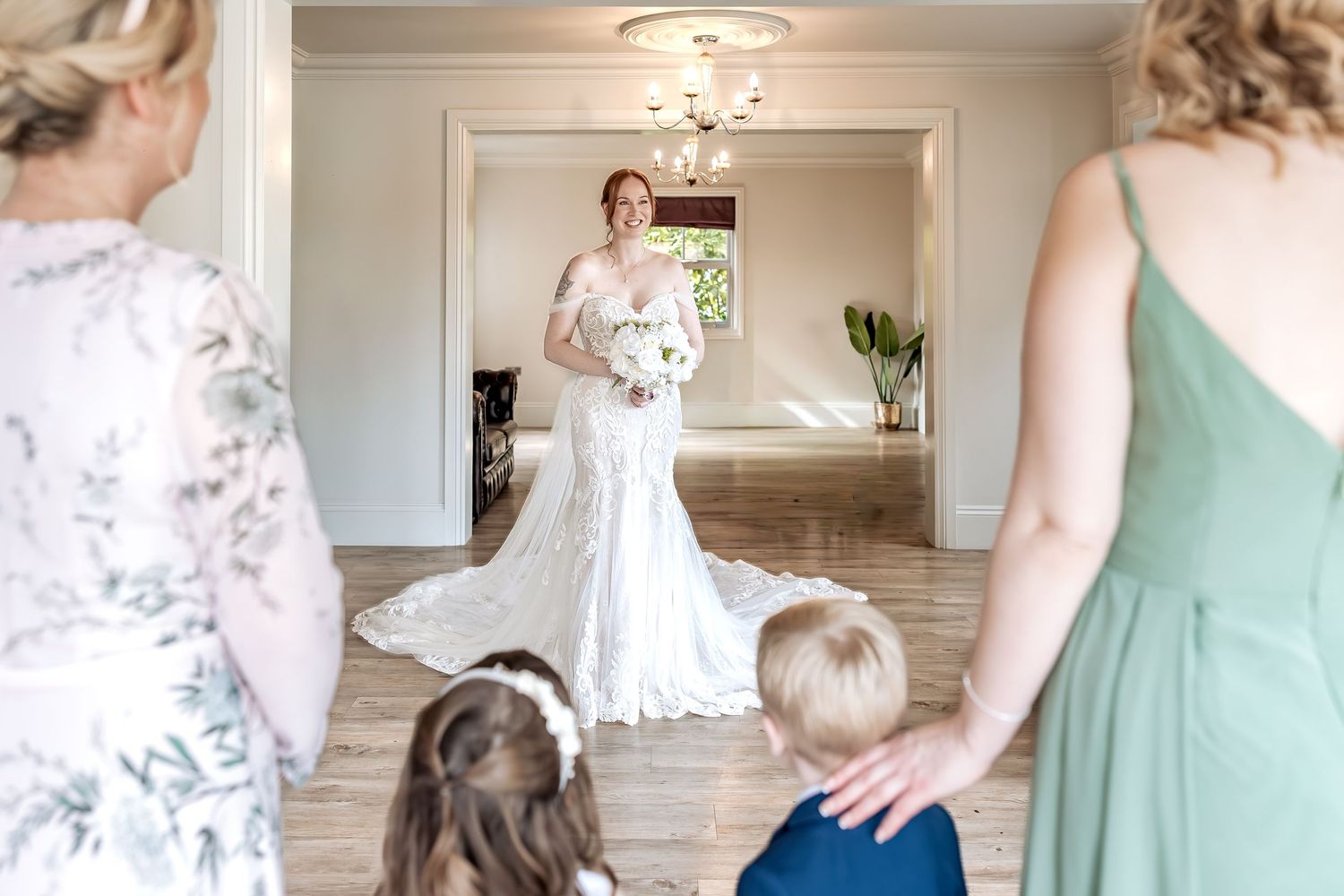 Natural first look moment between a bride and her family.