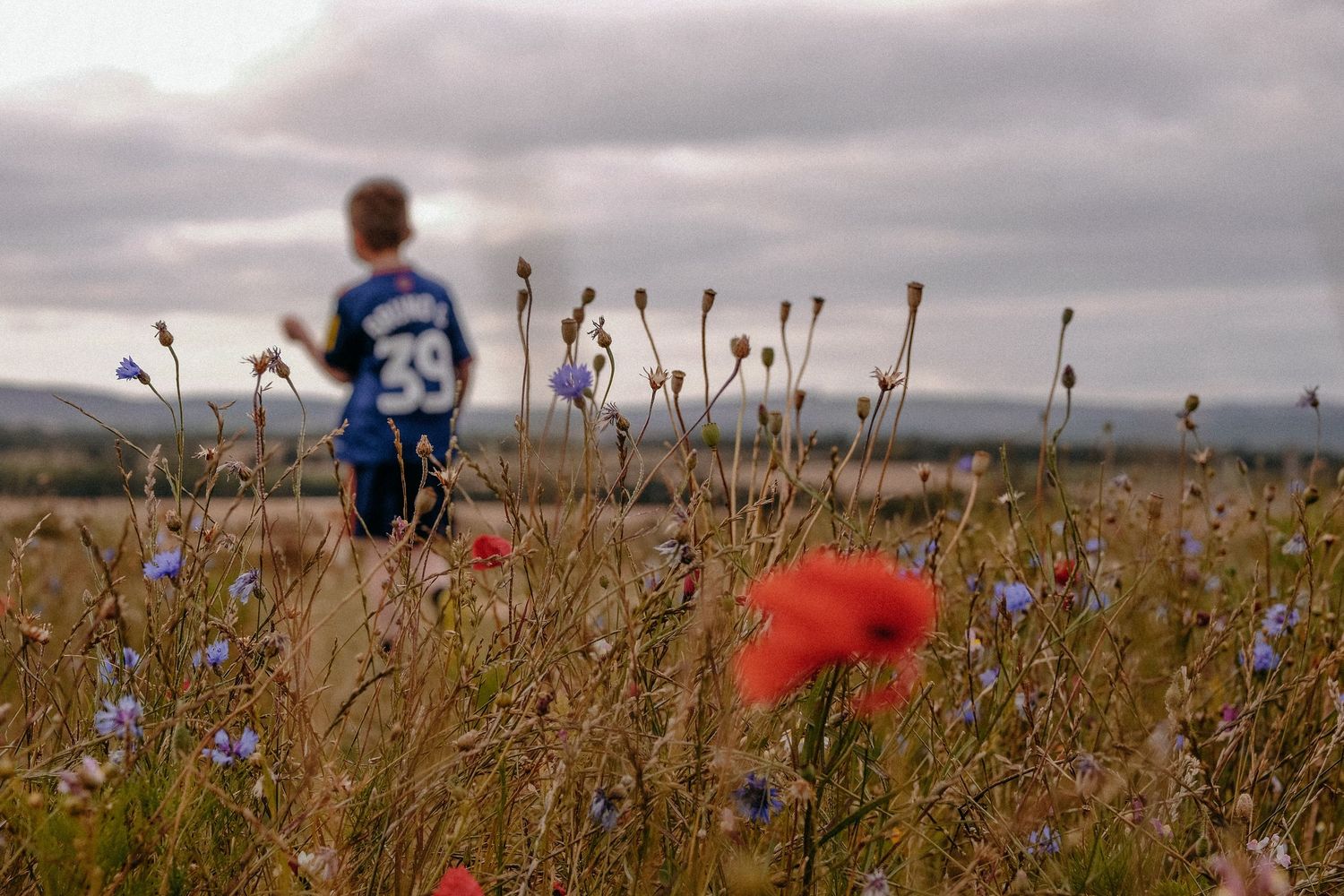 A smiling portrait of an autistic girl as she plays during a photo shoot in Monkseaton
