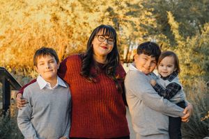 Family portrait sequence outdoors during golden sunset.