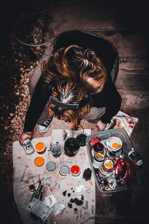 Overhead view of drinks and food items arranged on a dark wooden table.