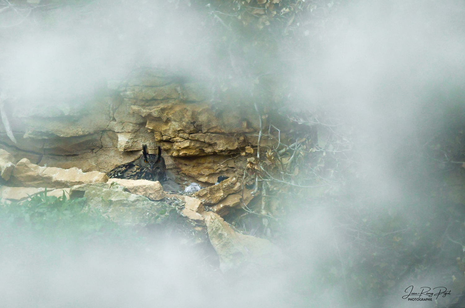 Misty abstract landscape painting with earthy tones and turquoise accents creates a dreamy mountainous atmosphere.